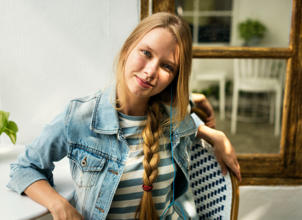 A teenager smiling sweetly