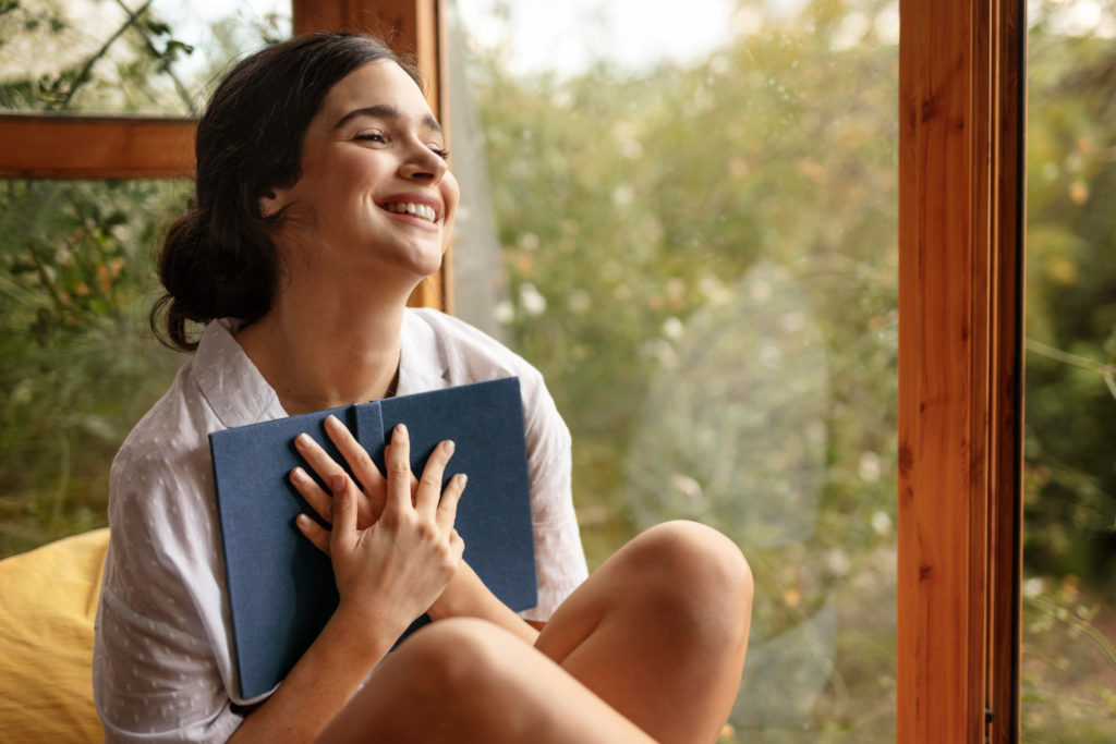 A woman feeling extremely happy