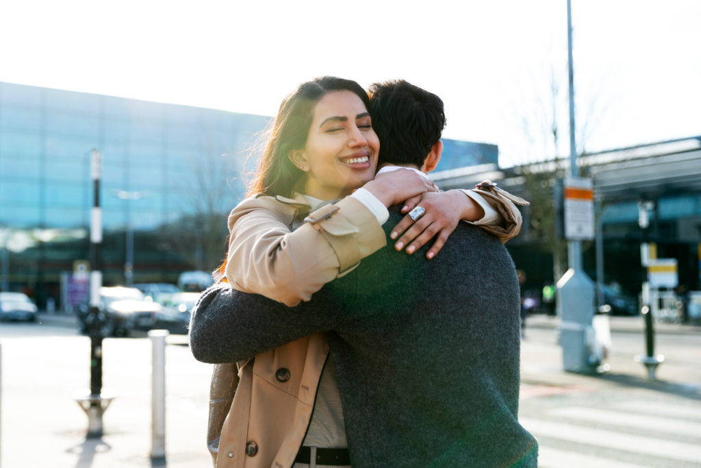 Two people happily embracing each other