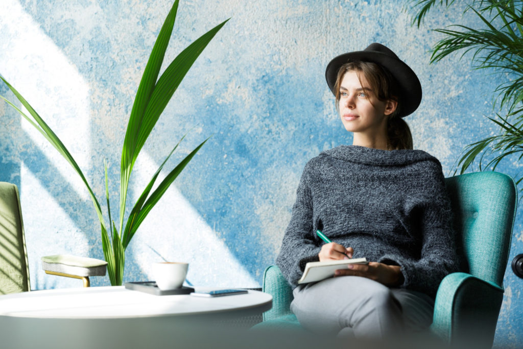 A woman in a hat reminiscing
