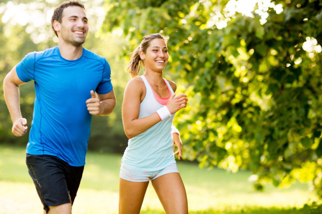 Two people happily running together